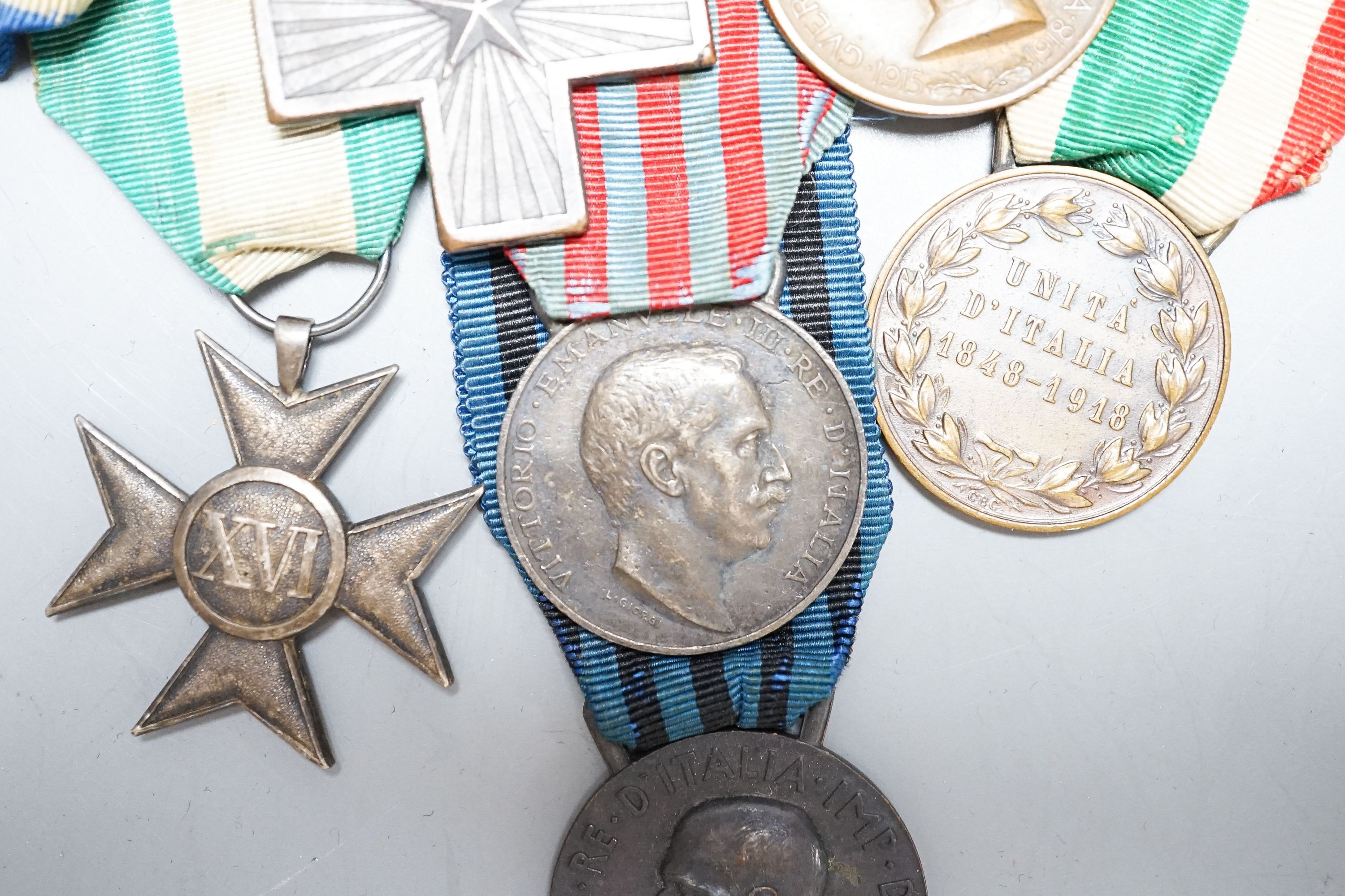 An Italian WWI medal group of six, including War Cross, War of Italian independence 1915–18 with four clasps, Libya 1911, United Italy 1848-1918, Ethiopian campaign 1935 and Army long service medal